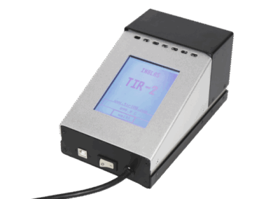 Front view of the TIR100-2 portable emissometer showing a TIR-2 emissivity reading on its screen.