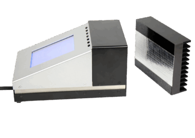 Portable TIR100-2 emissometer measuring the thermal emissivity of a coated glass sample.