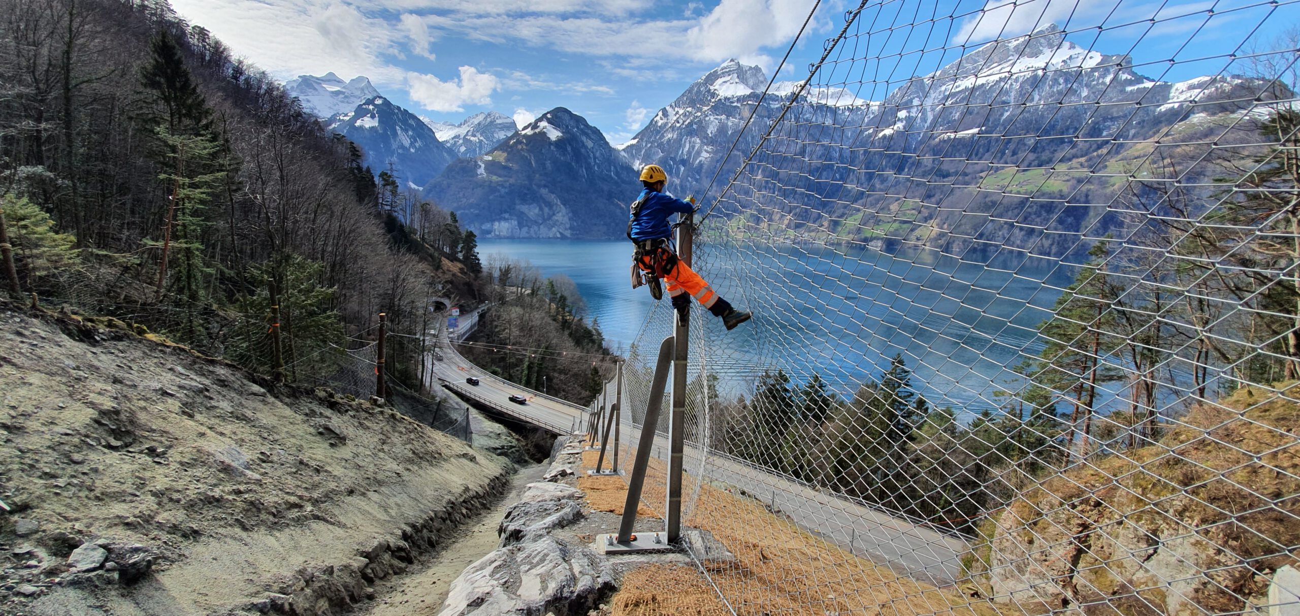 Rockfall barrier protecting a railway cutting in mountainous terrain