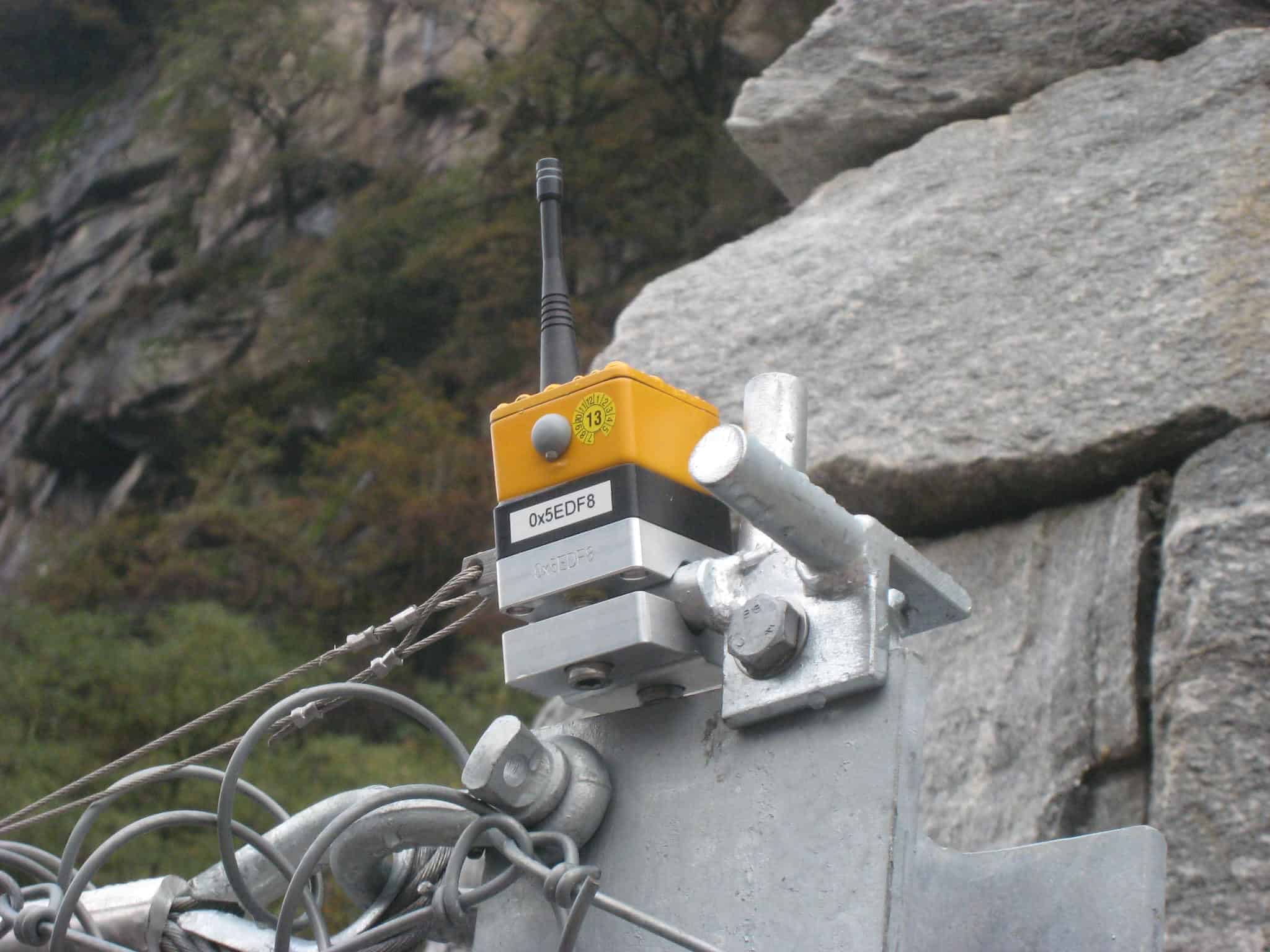 ImpactSentinel sensor installation on rockfall protection barrier