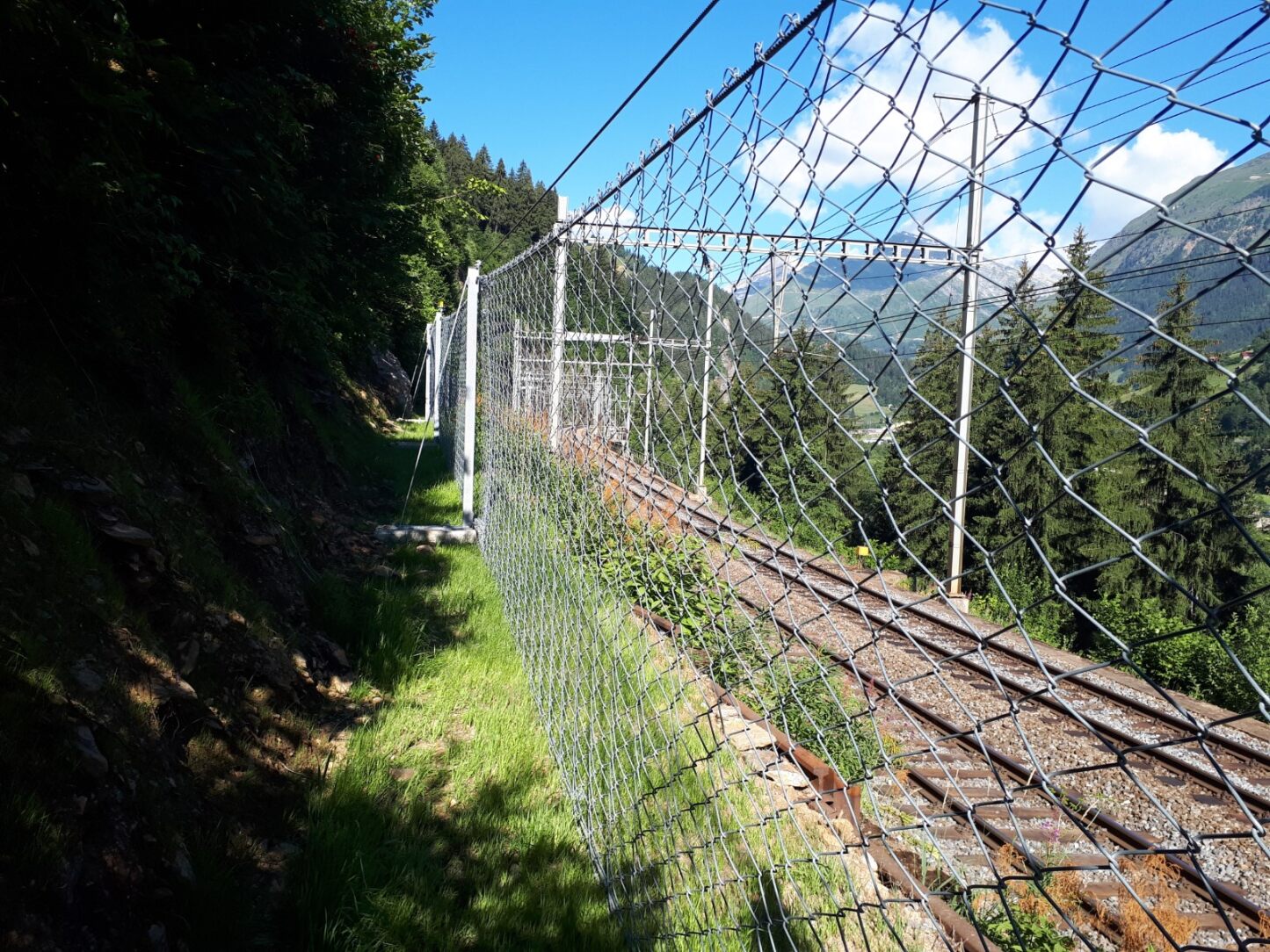 Rockfall debris caught in a barrier net after an impact event